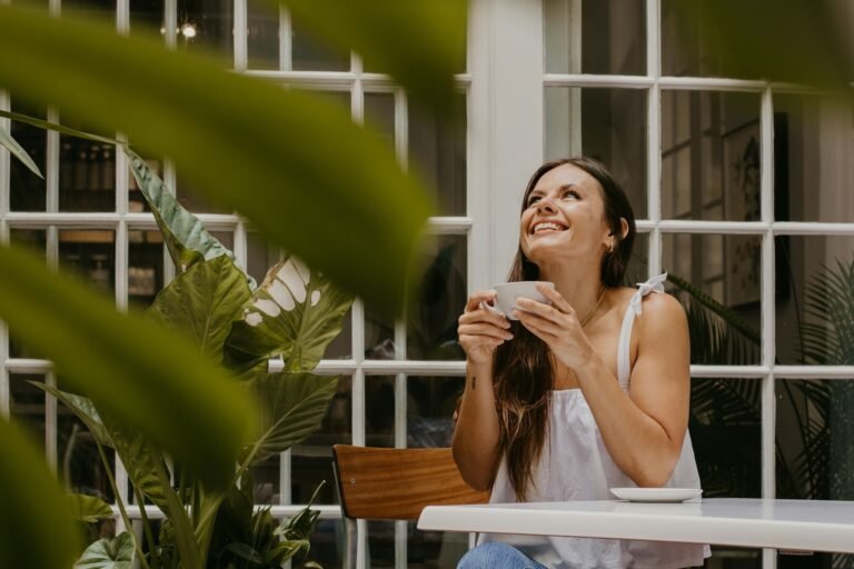 Woman having a coffee break as part of living a balanced life