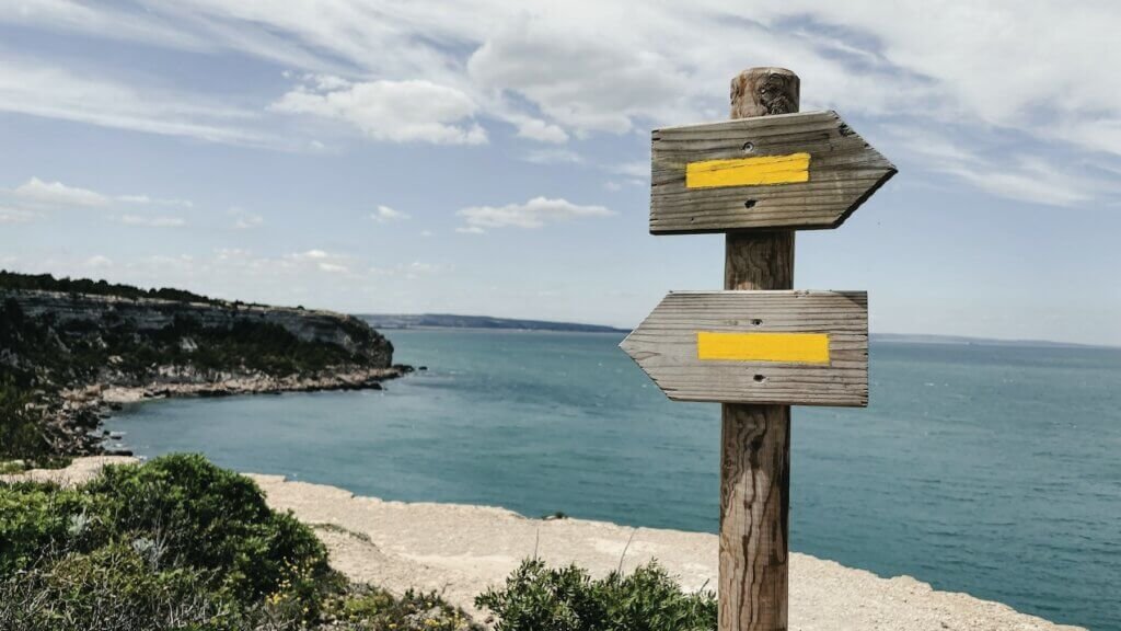 Sign with two different directions as a metaphor for choosing which direction to go in line with your core values