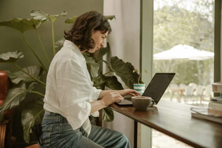 Woman using a laptop to research different types of hobbies