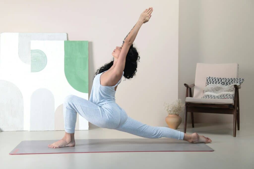 Photo of a woman doing yoga - one of the hobbies for relaxation after a busy day.