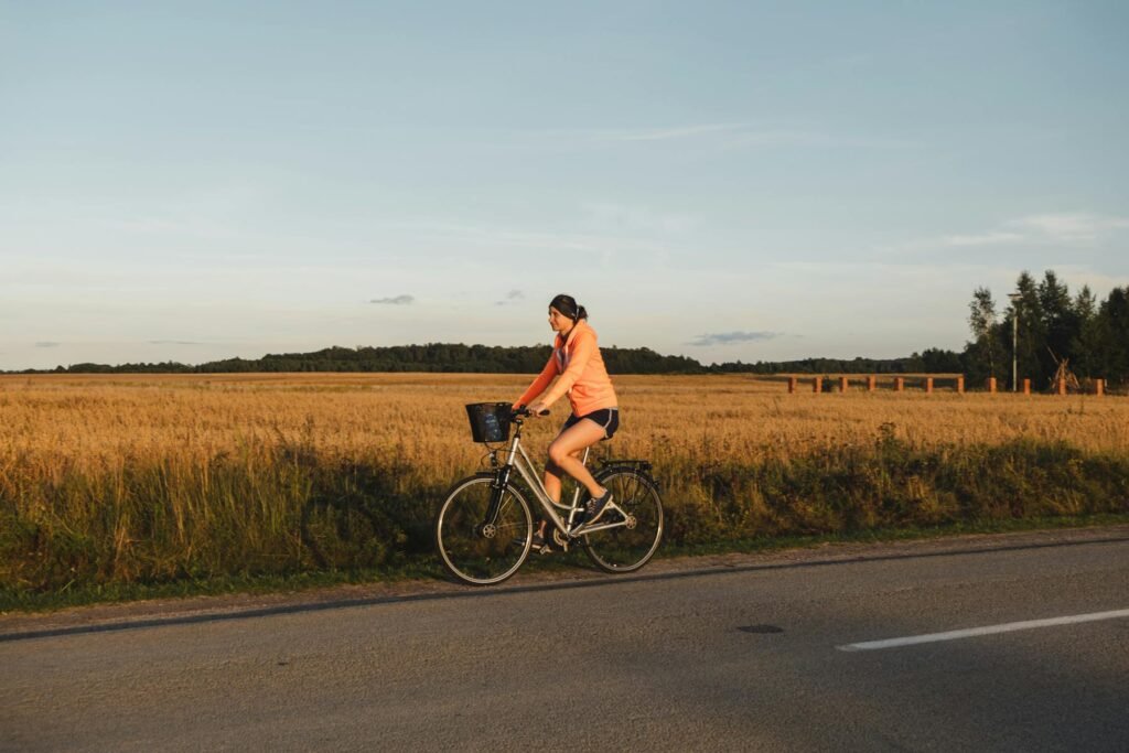 Woman cycling - enjoying one of her active hobbies